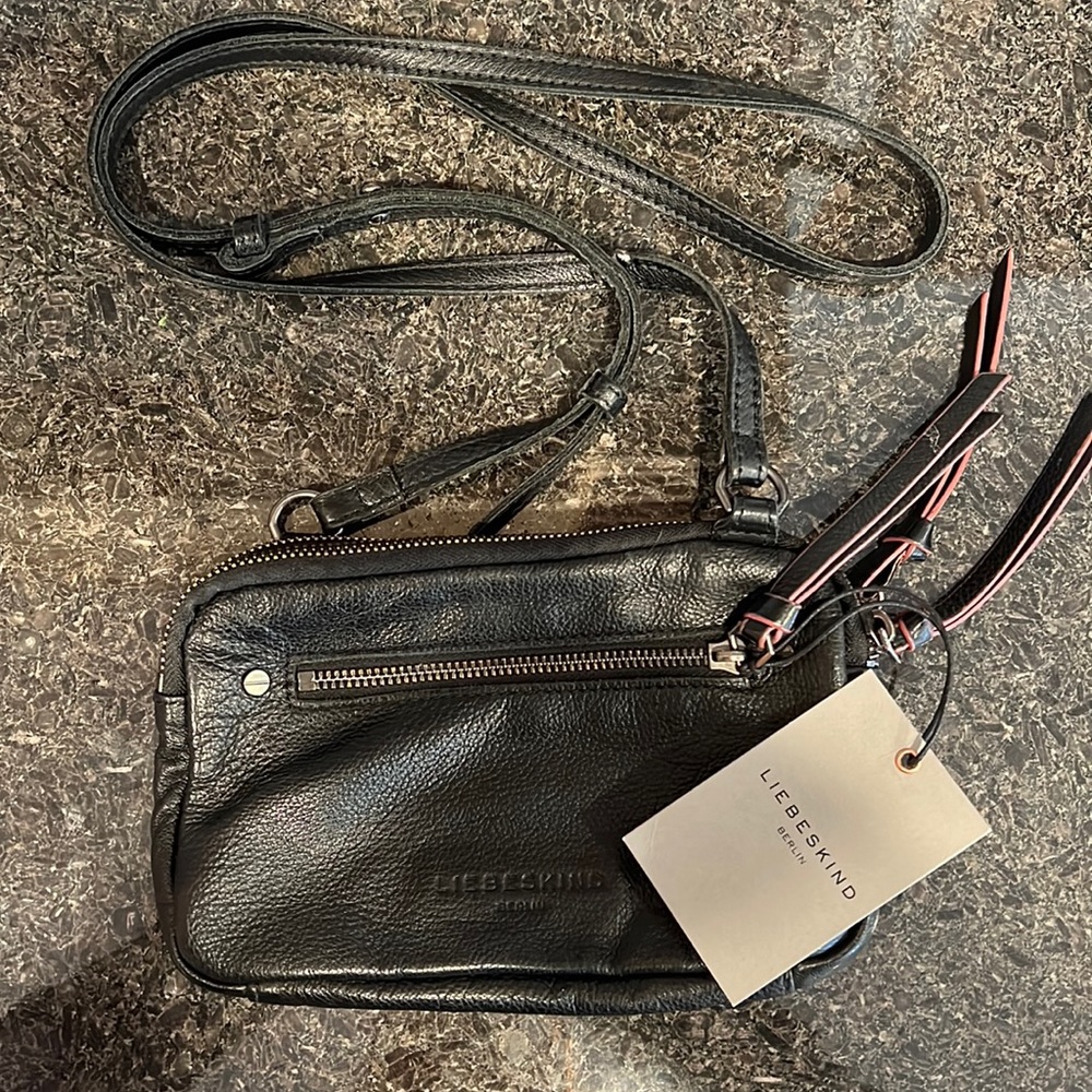 Liebeskind Purse new with tag. Black leather. Multi zippered pockets.